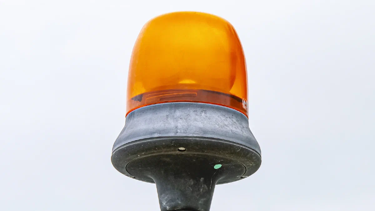 An orange warning beacon mounted on the roof of a construction vehicle